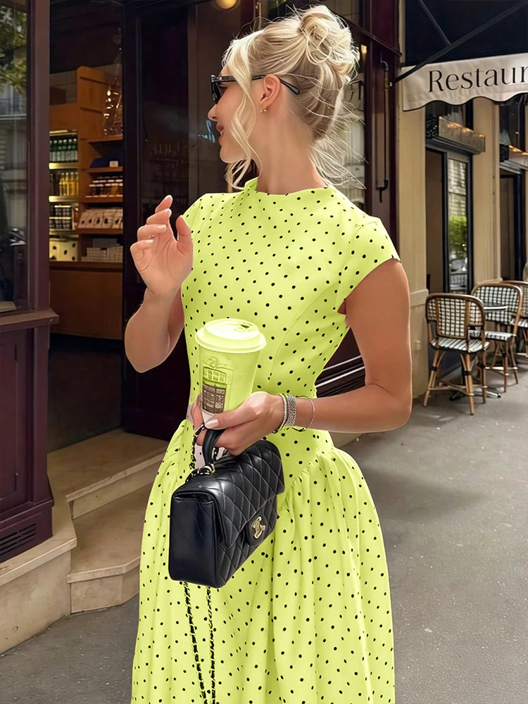 Elettra Ferri polka dot slim maxi dress with a flowing silhouette and sleeveless design, perfect for summer occasions.
