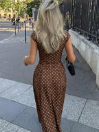 Polka dot slim maxi dress by Elettra Ferri featuring a flowy silhouette and stylish design, shown in a vibrant pattern.
