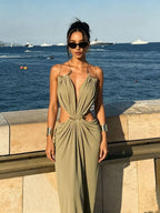 Elettra Ferri halter maxi dress with flowing fabric, deep V neckline, and ankle-length silhouette, perfect for elegant summer wear.