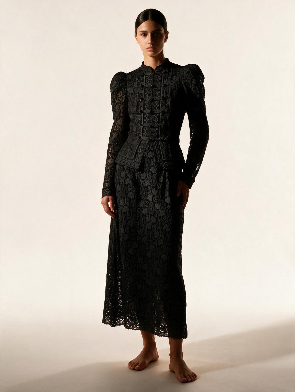 Elettra Ferri slim lace hollow-out long sleeve blouse with intricate lace details and a fitted silhouette.