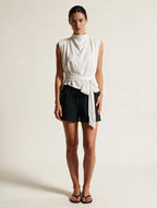 Elettra Ferri pleated tank top dress worn by a model, lightweight fabric with a flowing silhouette and pleated design.