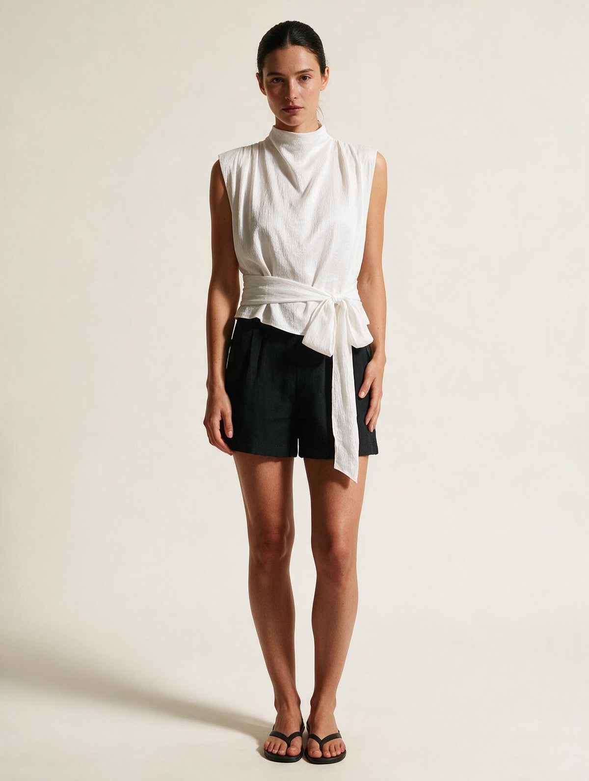 Elettra Ferri pleated tank top dress worn by a model, lightweight fabric with a flowing silhouette and pleated design.