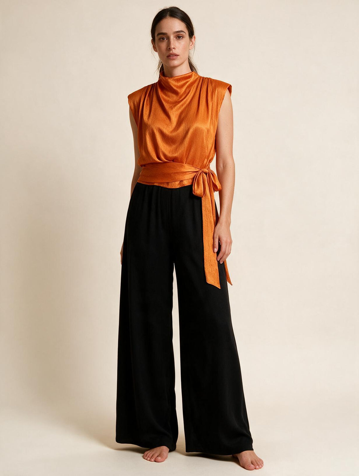 Elettra Ferri pleated tank top dress worn by a model, showcasing a stylish, flowy design perfect for casual or summer wear.