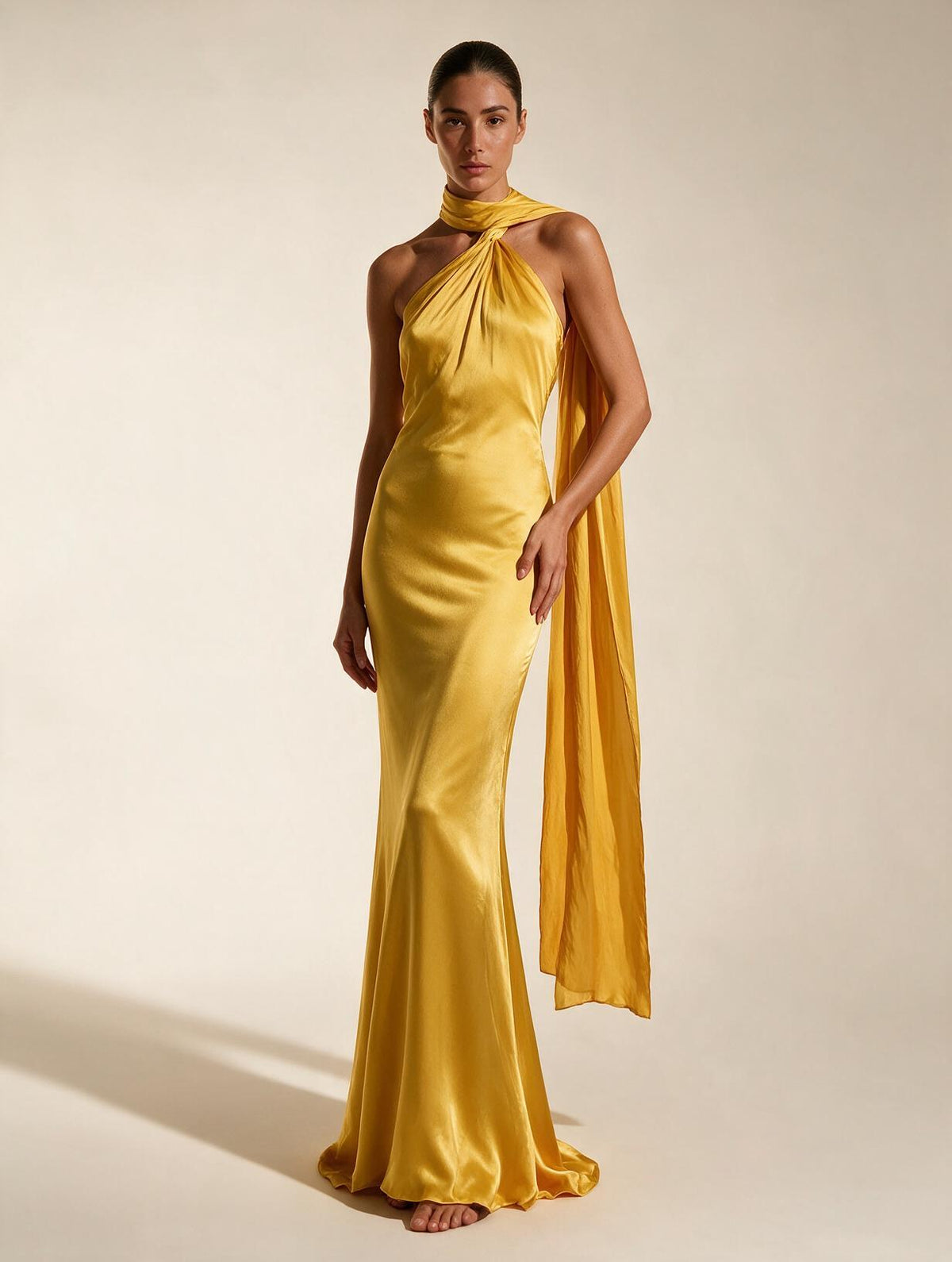 Elettra Ferri halter maxi dress worn by a model, flowing fabric, elegant design, perfect for summer occasions.