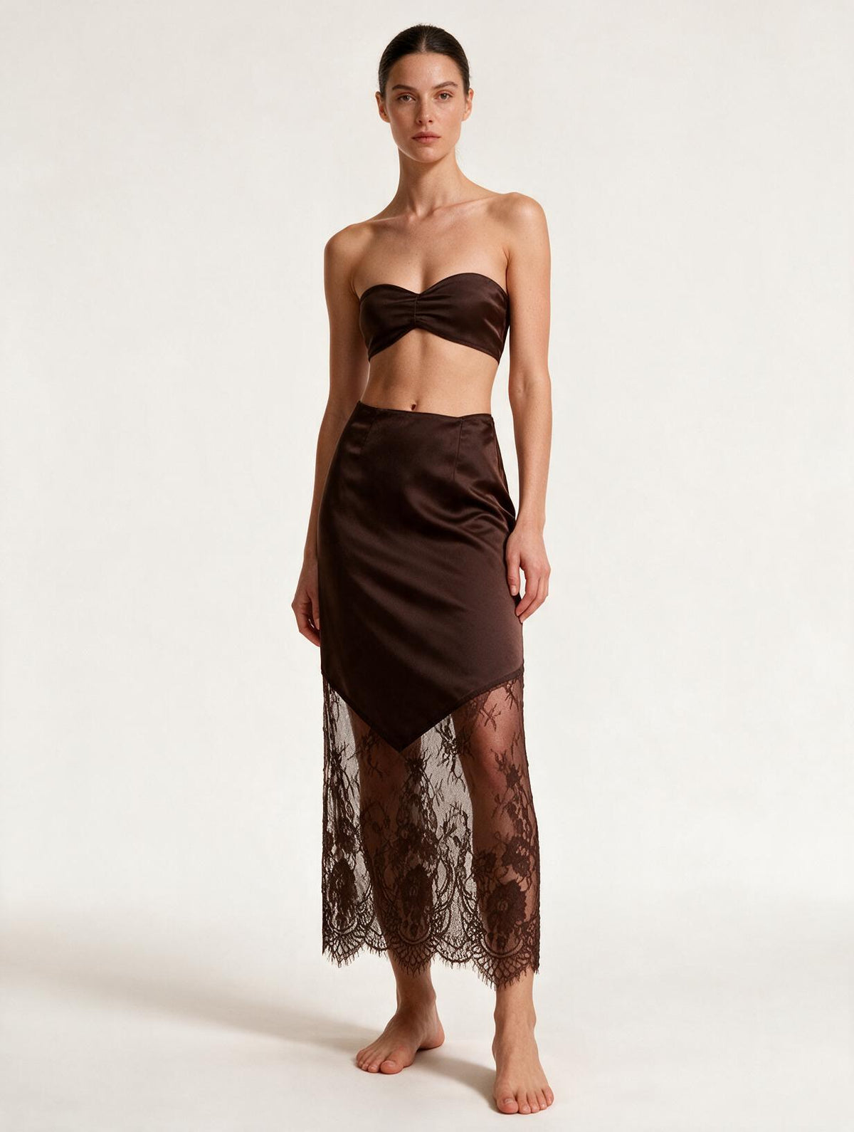 Elettra Ferri brown lace boho party skirt worn by a model, showcasing its flowy design and intricate fabric details.