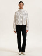 Model wearing Elettra Ferri polka dot casual loose jacket, stylish casualwear with a relaxed fit and playful pattern.