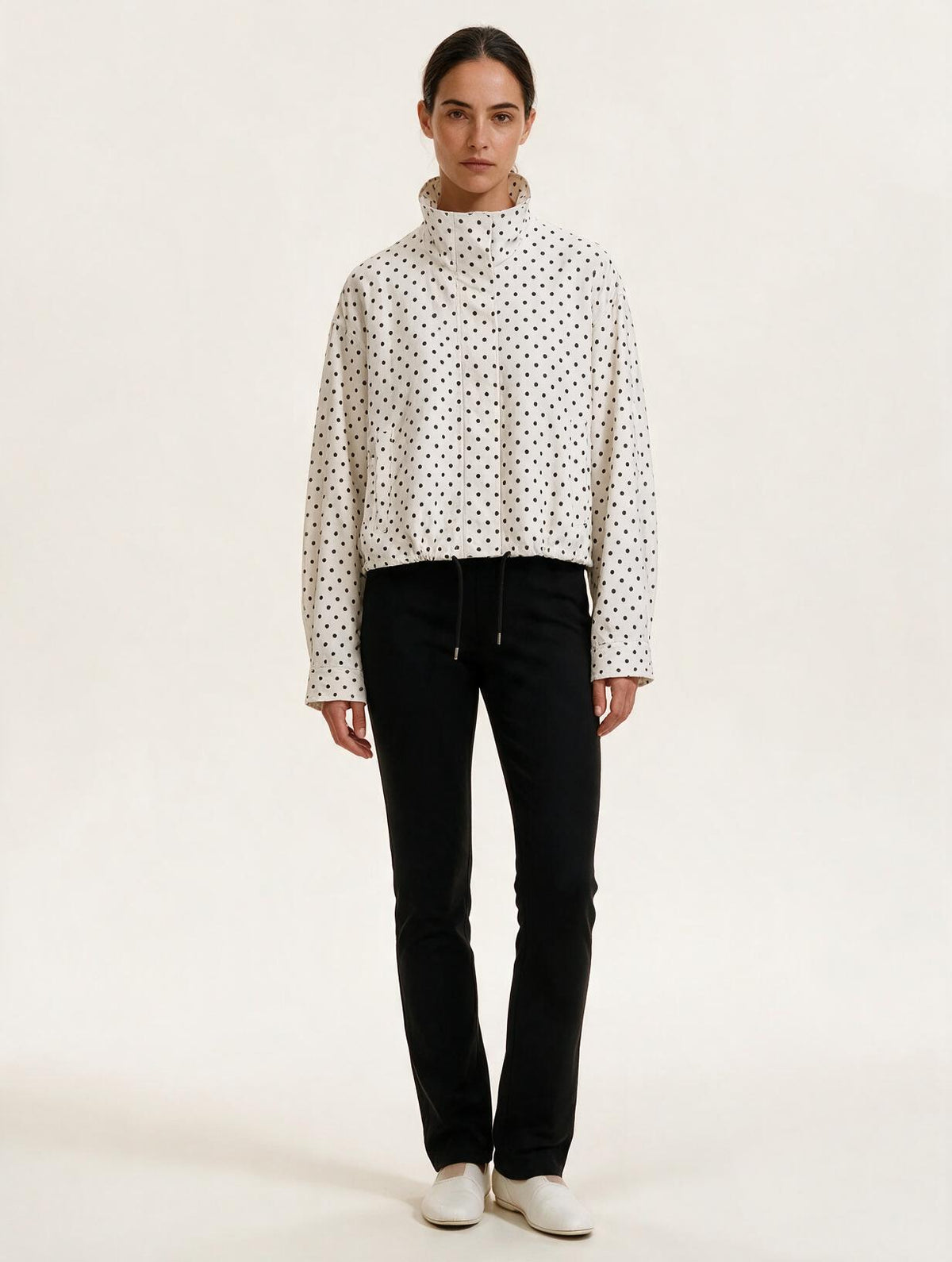 Model wearing Elettra Ferri polka dot casual loose jacket, stylish casualwear with a relaxed fit and playful pattern.