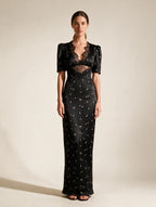 Elettra Ferri Lace Elegance Maxi Dress worn by a model, showcasing intricate lace details and flowing silhouette.