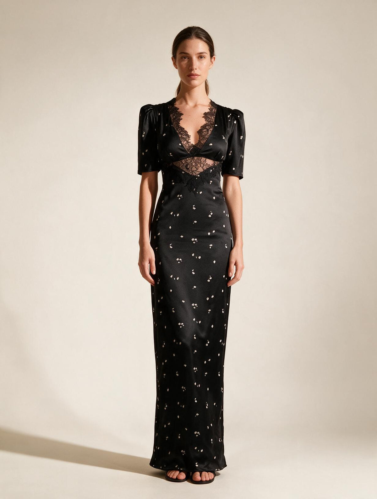 Elettra Ferri Lace Elegance Maxi Dress worn by a model, showcasing intricate lace details and flowing silhouette.