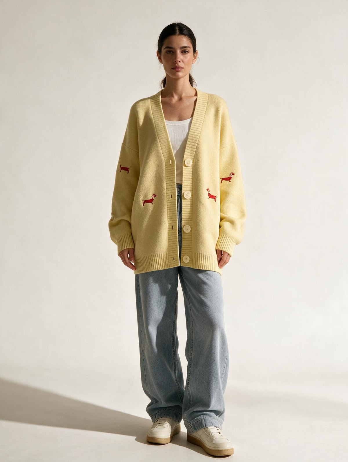 Elettra Ferri embroidered V-neck knit cardigan worn casually, featuring colorful embroidery and a relaxed fit on a model.