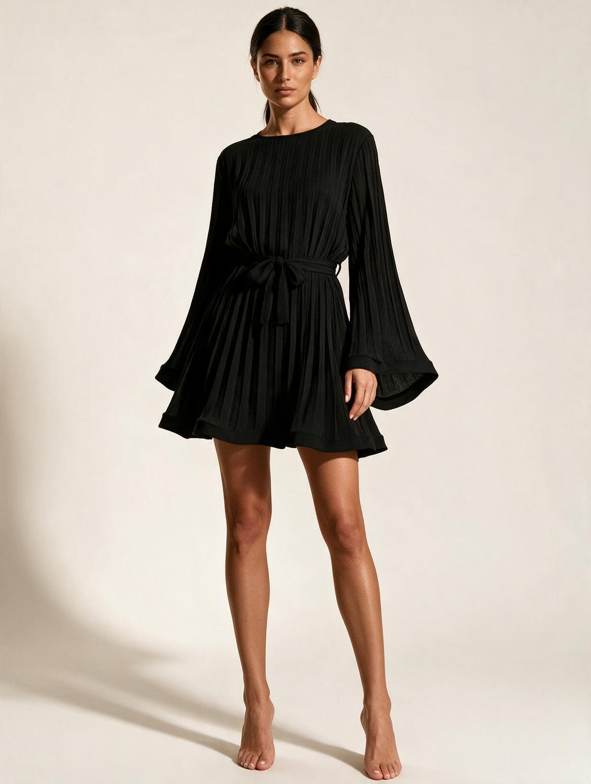 Elettra Ferri slim-fit knee-length sheath dress worn by a model, featuring a sleek and elegant design for formal occasions.