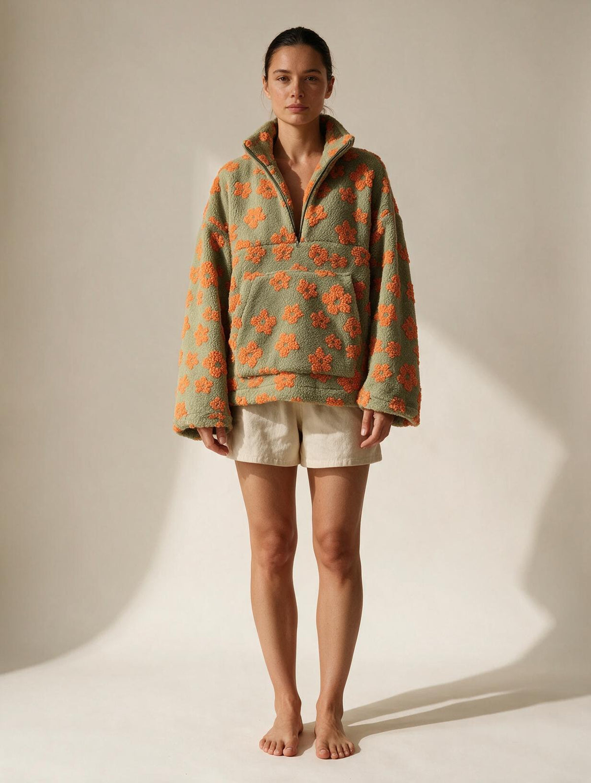 Elettra Ferri floral zip-detail fleece pullover coat worn by a model, featuring a floral pattern and zip front design.