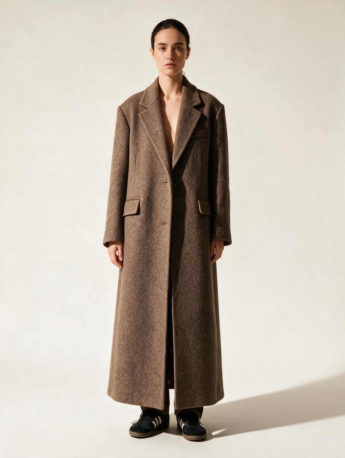 Elettra Ferri chic wool blend lapel coat modeled on a woman, showcasing its stylish collar and tailored fit.