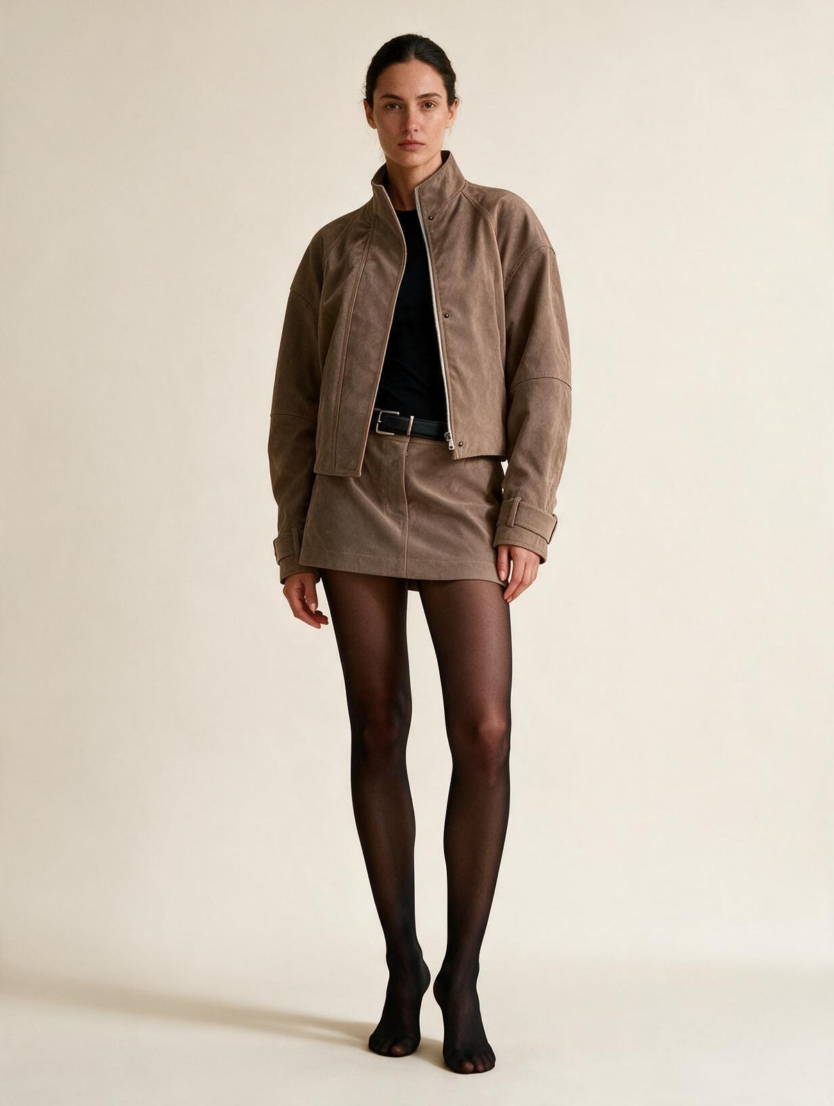 Elettra Ferri slim turtleneck two-piece skirt set coat styled on a model, showcasing a chic, fitted look.
