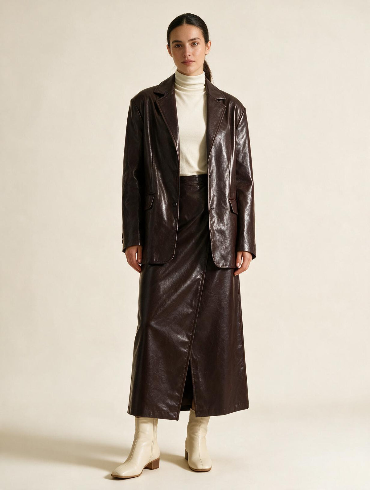 Elettra Ferri tailored button-front coat worn by a model, featuring a sleek design and structured fit for a sophisticated look.