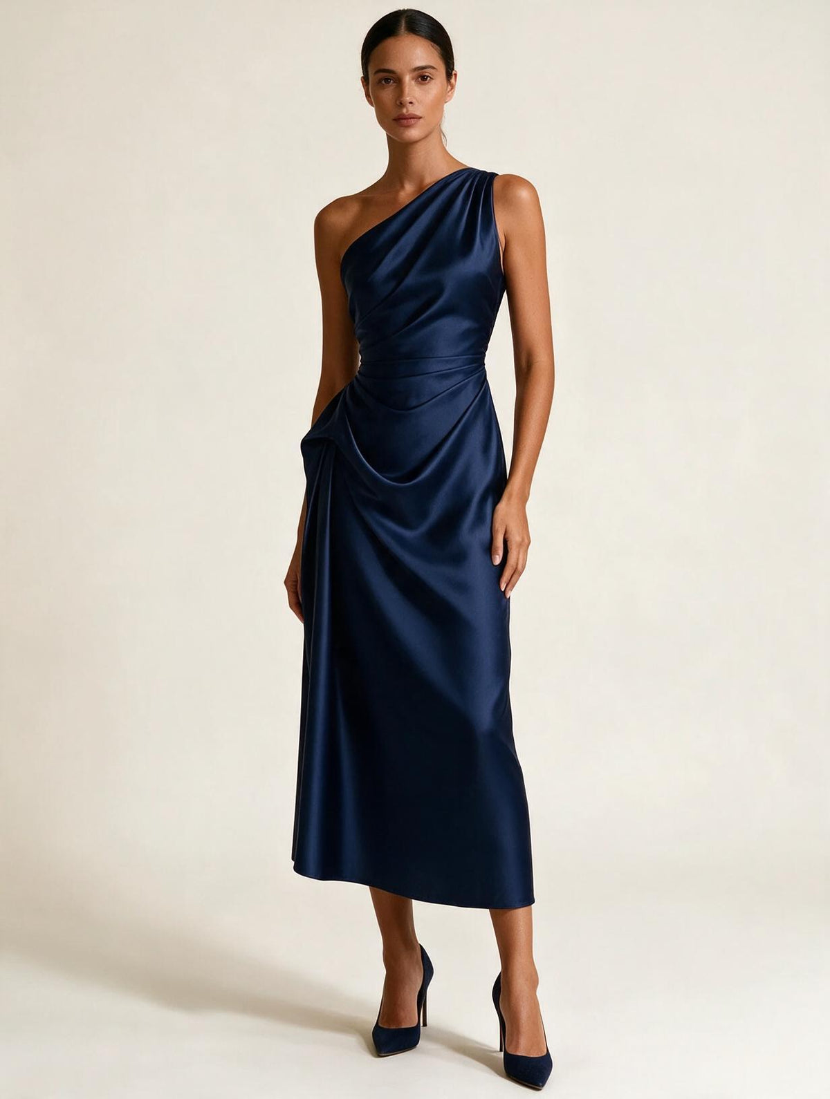 Elettra Ferri satin pleated dress on a model, showcasing elegant design and flowing fabric in a stylish evening dress.