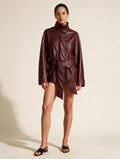 Elettra Ferri solid faux leather coat on a model, showcasing a stylish fashion jacket with a sleek design and collar detail.