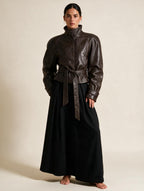 Elettra Ferri structured zip coat worn by a model, featuring a sleek design with a front zipper and tailored fit.