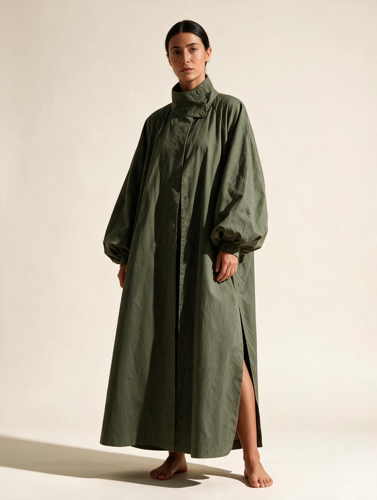 Elettra Ferri long oversized puff sleeve trench coat worn by a model, showcasing its stylish design and oversized fit.