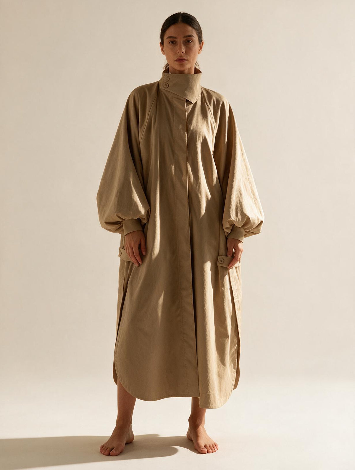 Elettra Ferri long oversized puff sleeve trench coat worn by a model, featuring a stylish and modern design.