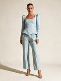 Elettra Ferri casual solid-colored wool outerwear set worn by a model, featuring a cozy jacket and matching trousers.