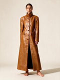 Elettra Ferri long turtleneck single-breasted coat worn by a model, featuring a sleek design and tailored fit.