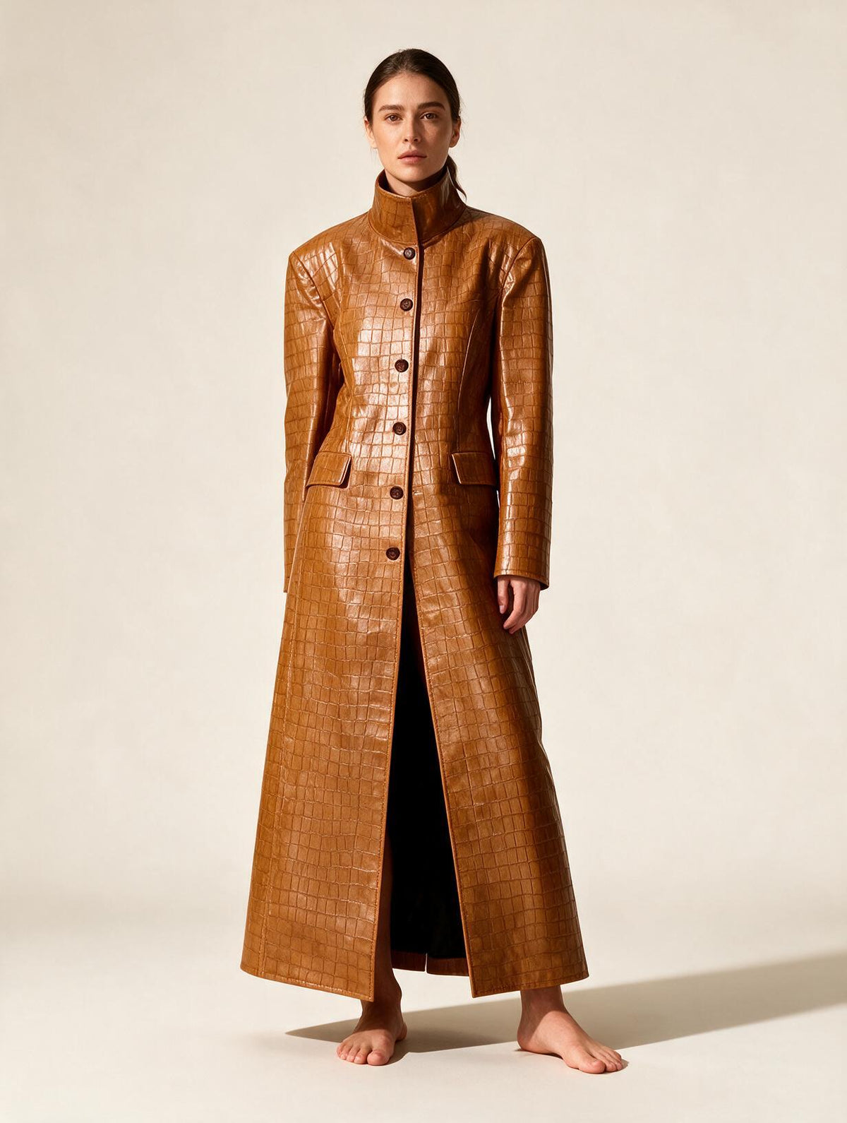 Elettra Ferri long turtleneck single-breasted coat worn by a model, featuring a sleek design and tailored fit.
