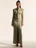 Model wearing Elettra Ferri's premium tailored blazer and midi skirt set, showcasing elegant fabric and stylish fit.