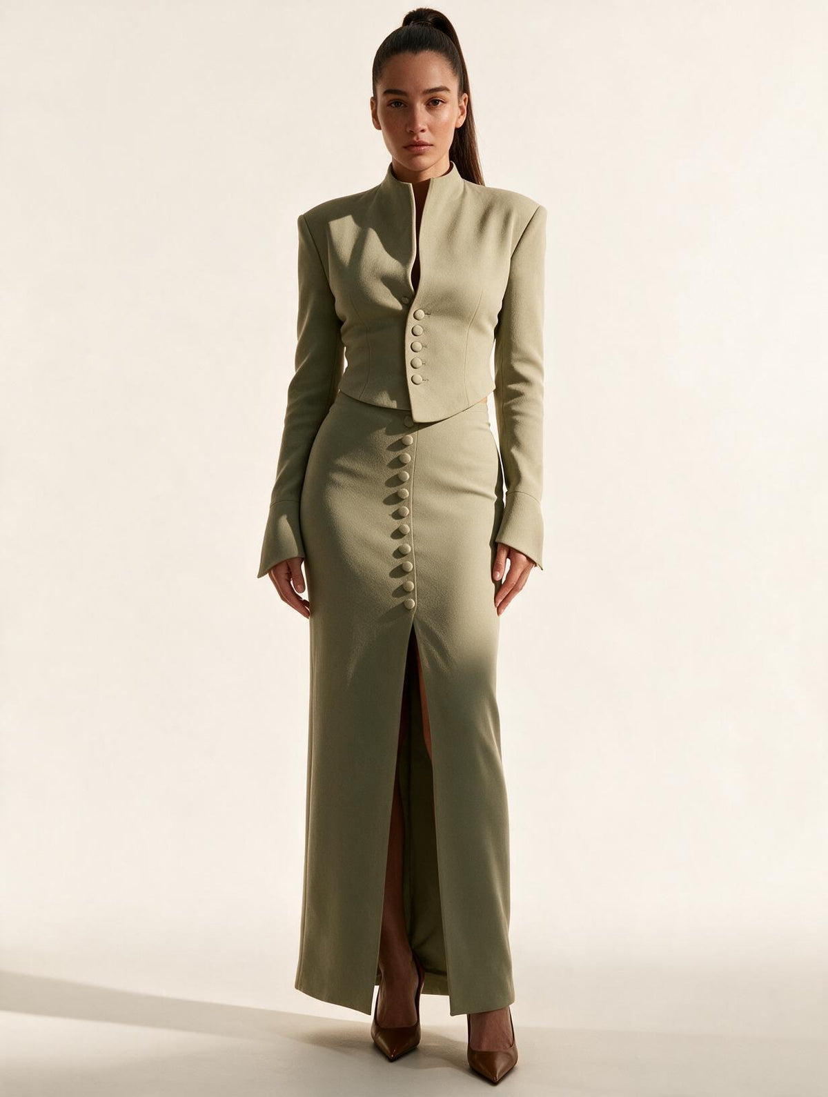 Model wearing Elettra Ferri's premium tailored blazer and midi skirt set, showcasing elegant fabric and stylish fit.