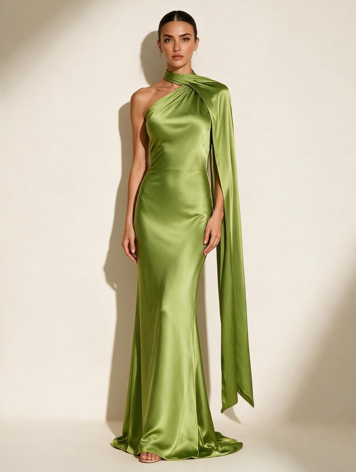 Elettra Ferri halter maxi dress worn by a model, flowing fabric, elegant design, sleeveless with a fitted waist.