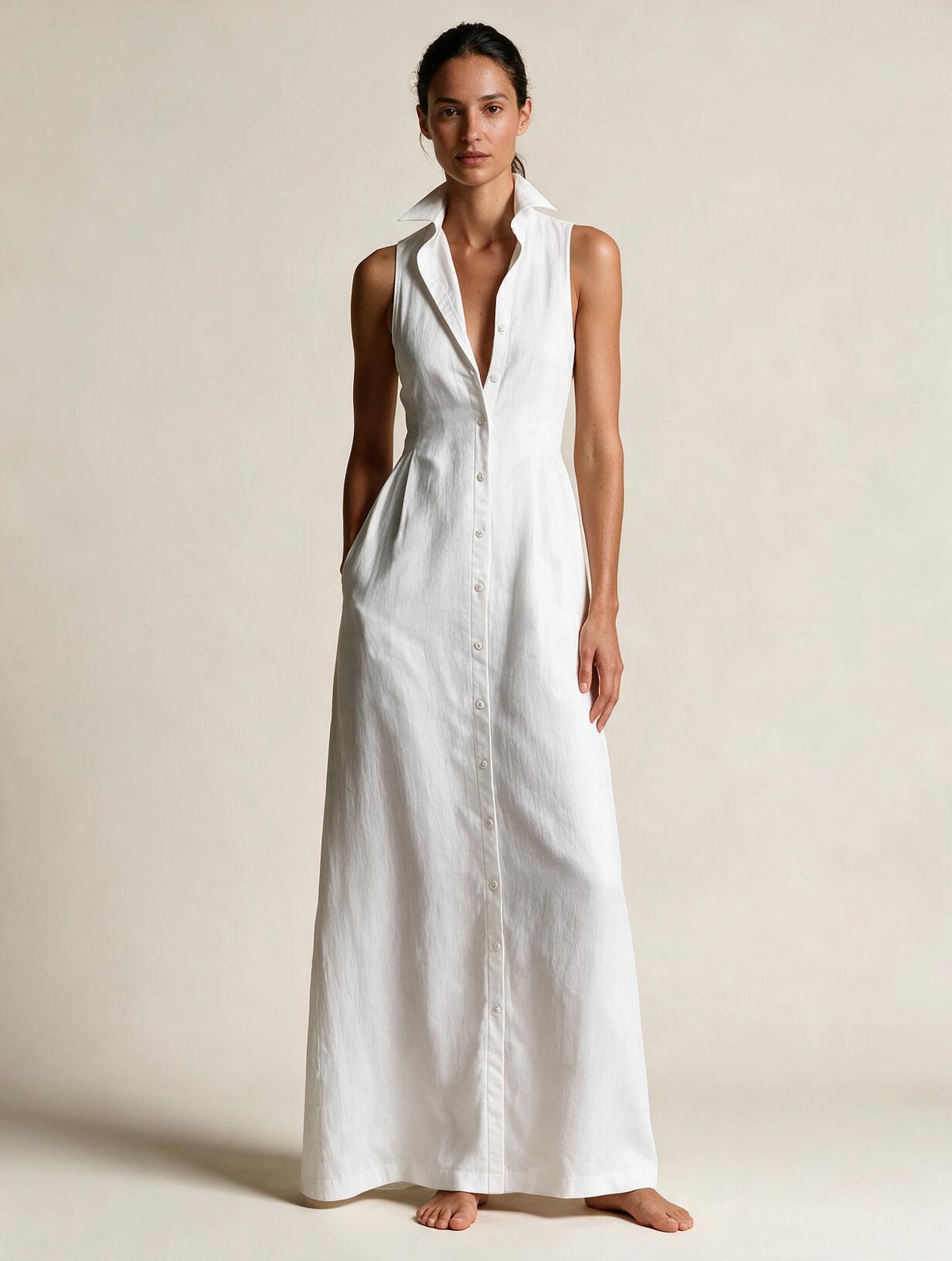 Elettra Ferri Elena V-neck sleeveless maxi dress worn by a model, flowing fabric and elegant design perfect for formal occasions.