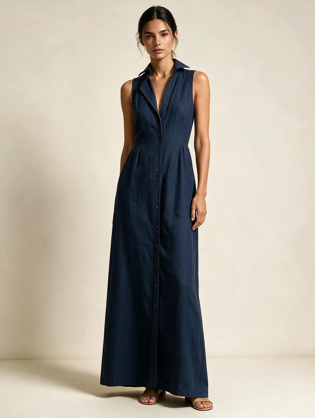 Elettra Ferri Elena V-neck sleeveless maxi dress modeled on a woman, flowing fabric, elegant design, perfect for formal occasions.