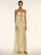 Elettra Ferri halter neck maxi dress with mesh details on a model, featuring a flowing silhouette and elegant design.