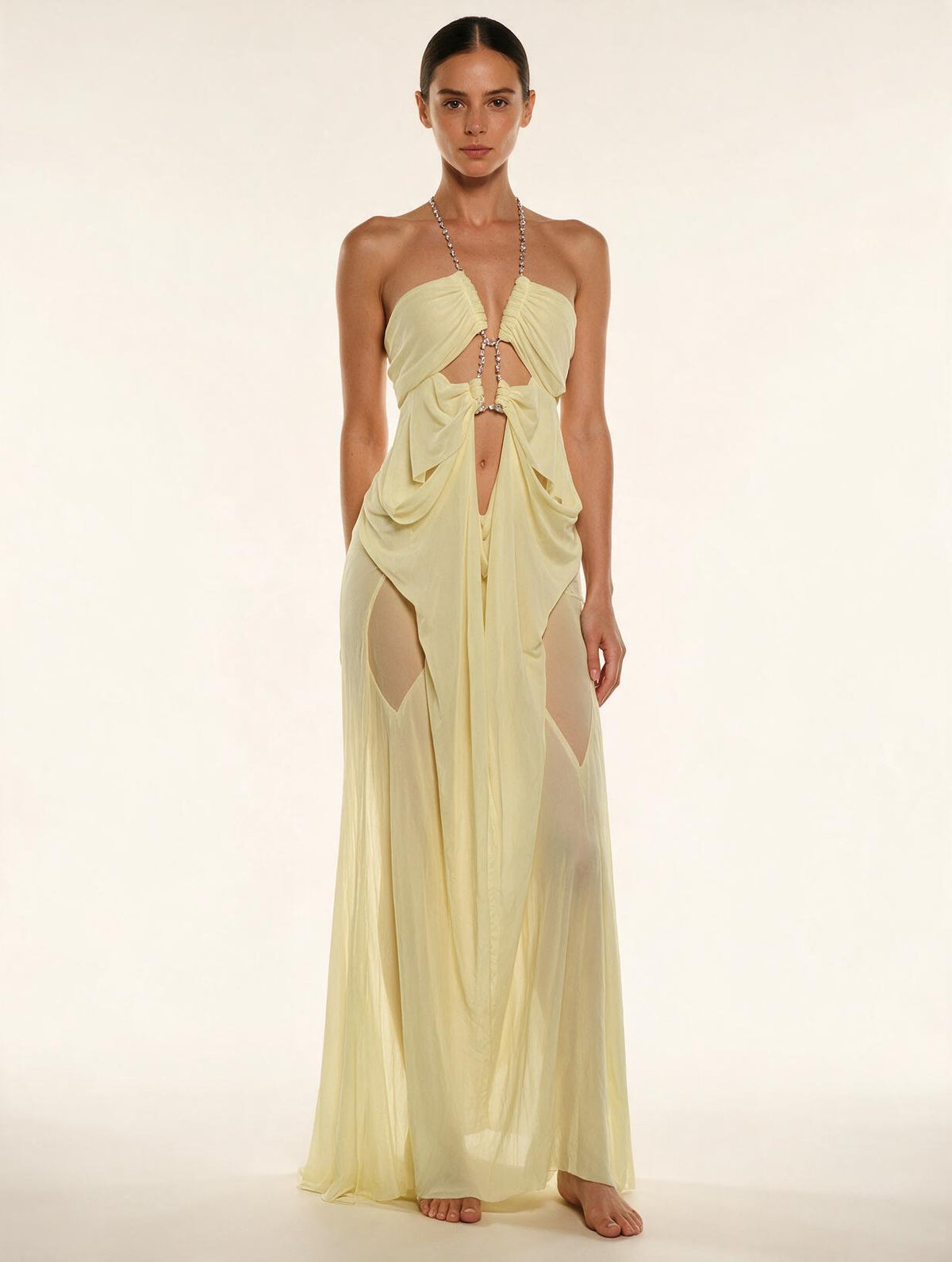 Elettra Ferri halter neck maxi dress with mesh details on a model, featuring a flowing silhouette and elegant design.