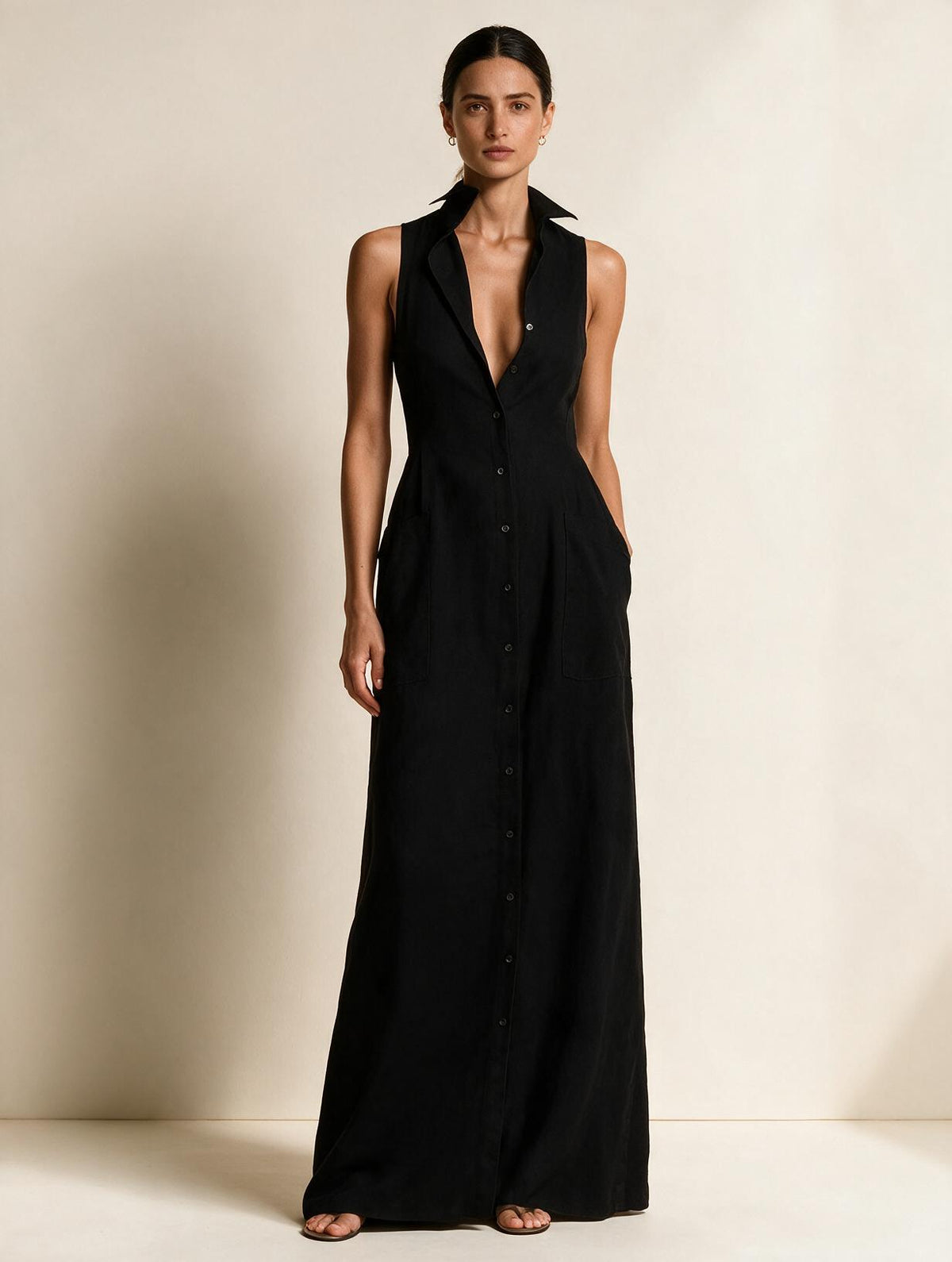 Elettra Ferri Elena V-neck sleeveless maxi dress worn by a model, flowing fabric, elegant design, perfect for summer occasions.