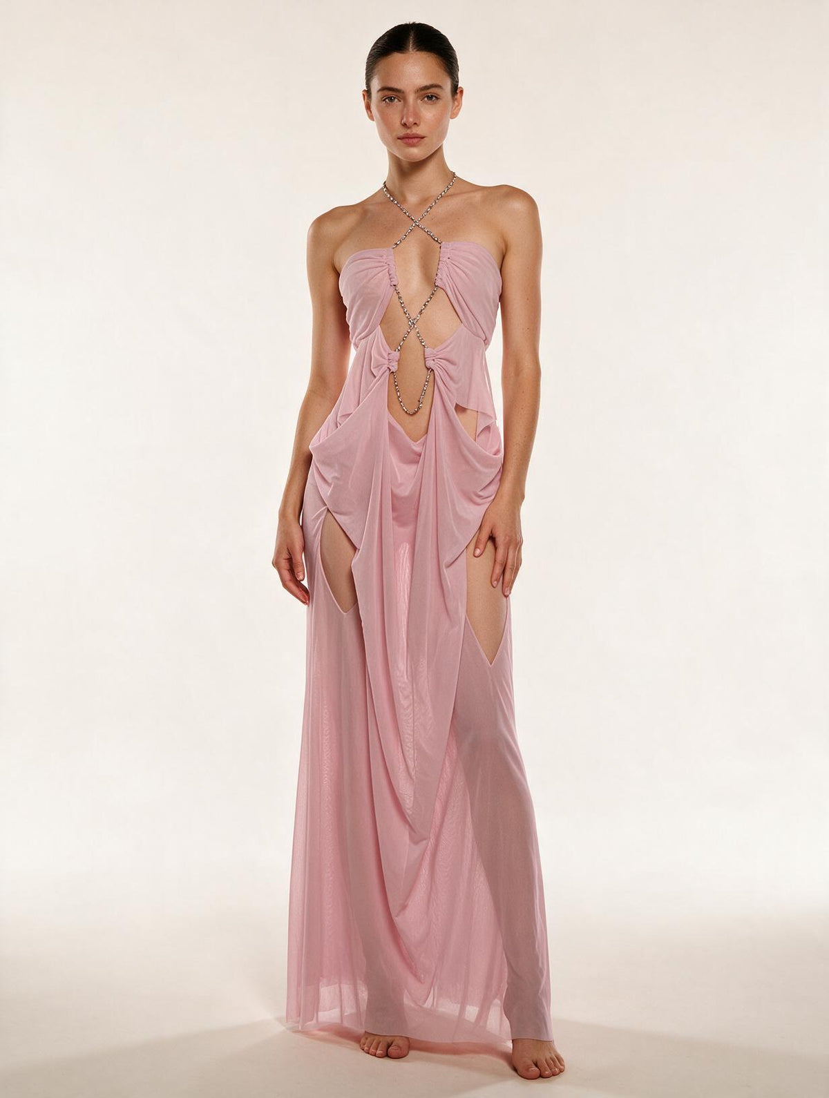 Elettra Ferri halter neck maxi dress with mesh detail, flowing fabric, and elegant design worn by a model