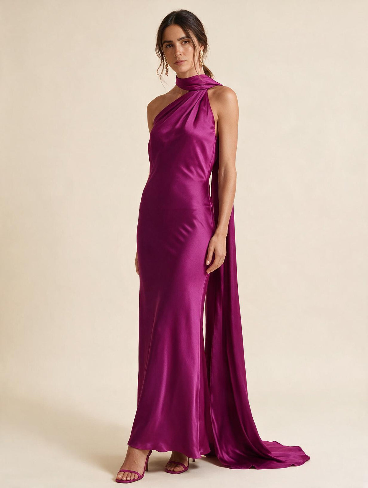 Elettra Ferri halter maxi dress worn by a model, featuring flowing fabric and elegant design, perfect for formal occasions.