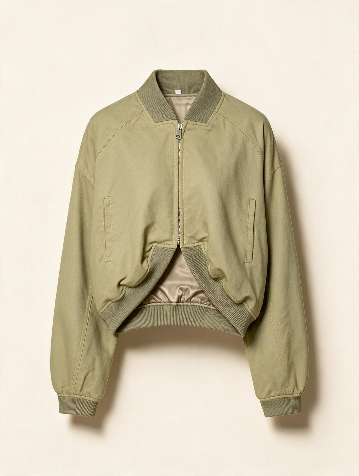 Elettra Ferri cropped zip-up moto jacket in black, displayed flat with front zipper and collar detail.