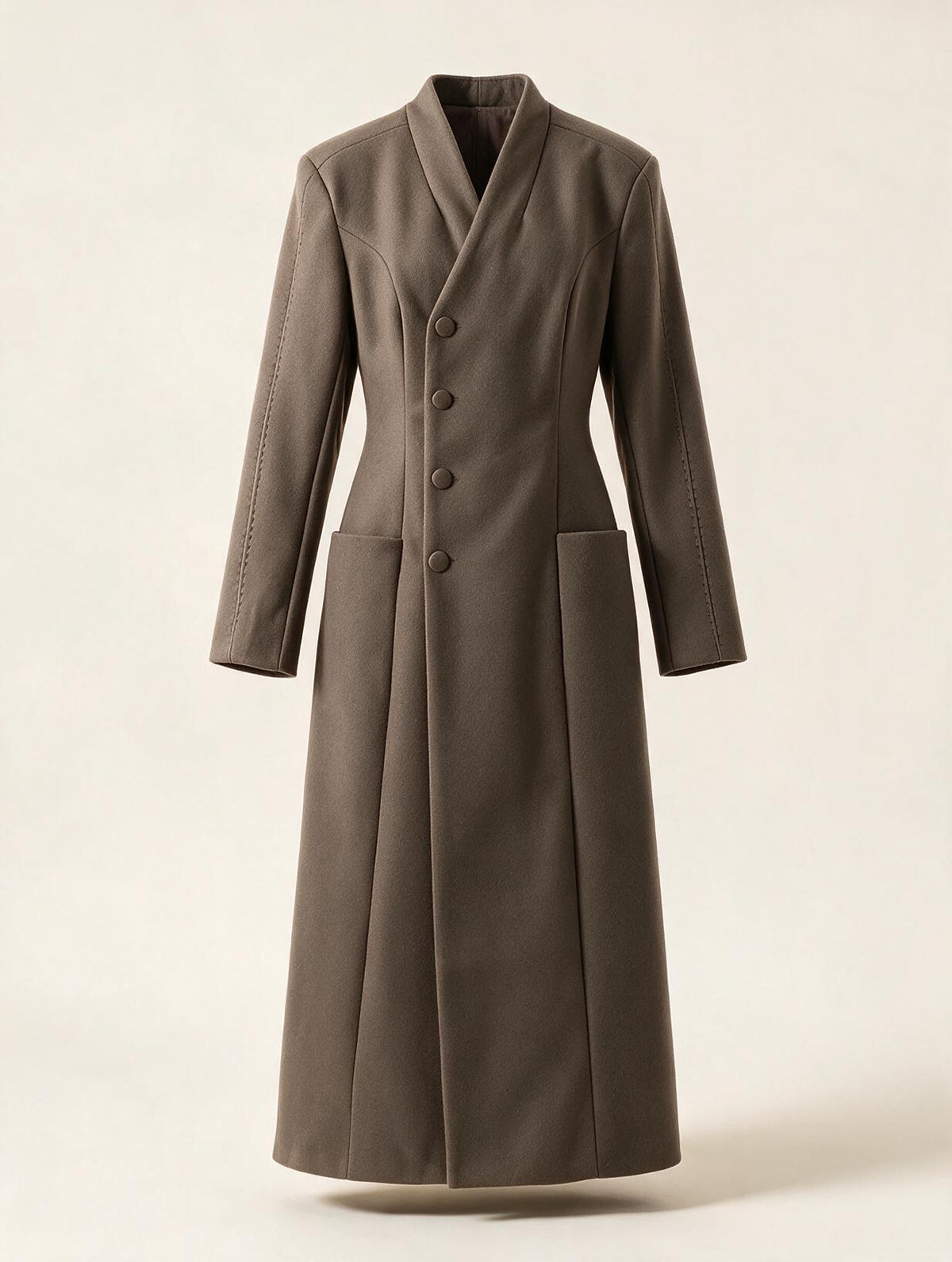 Elettra Ferri long tailored waist-cinched coat in neutral fabric, displayed on a hanger showing its structured design and classic silhouette.