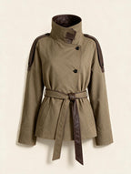 Elettra Ferri premium stand-collar woolen coat hanging on a rack, showcasing its tailored design and rich fabric texture.