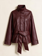 Elettra Ferri solid faux leather jacket coat with a sleek design, shown without a model, close-up of the black leather material.