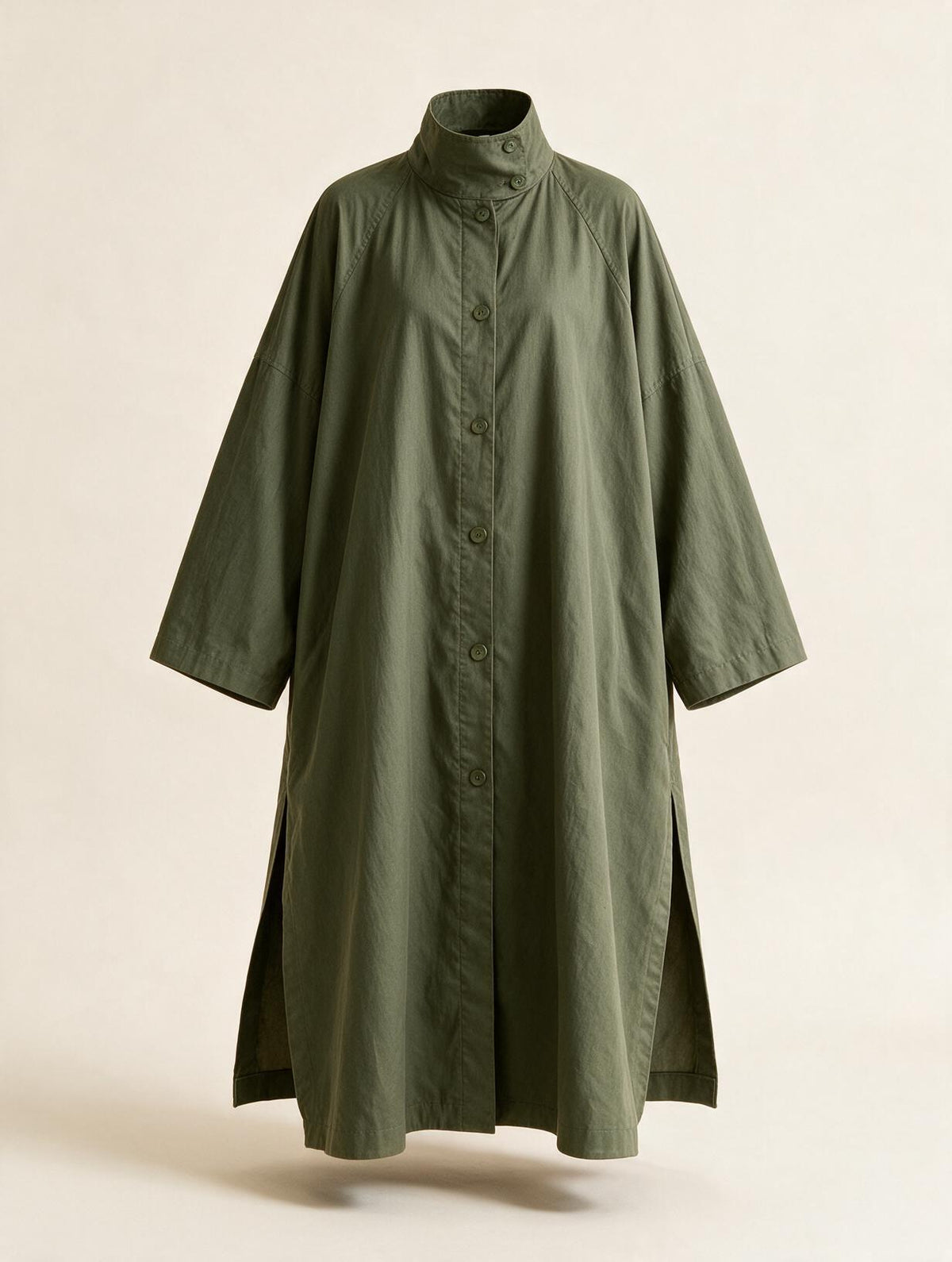 Long oversized puff sleeve trench coat by Elettra Ferri, shown in a neutral color, featuring a classic silhouette and dramatic puff sleeves.