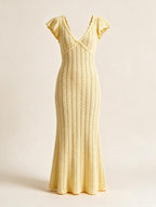 Elettra Ferri V-neck openwork maxi dress with intricate lace details, flowing fabric, and elegant design.