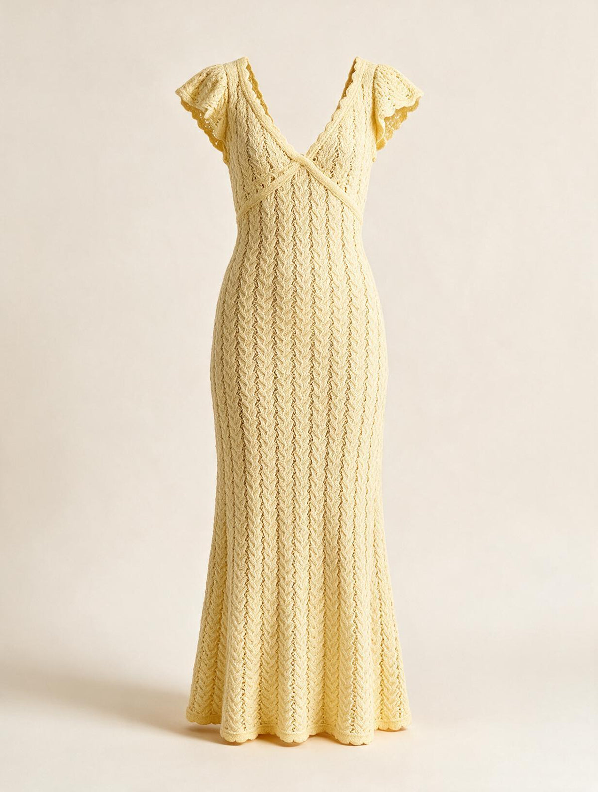 Elettra Ferri V-neck openwork maxi dress with intricate lace details, flowing fabric, and elegant design.