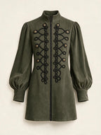 Vintage high-neck mini dress with lantern sleeves by Elettra Ferri, shown hanging on a plain background.