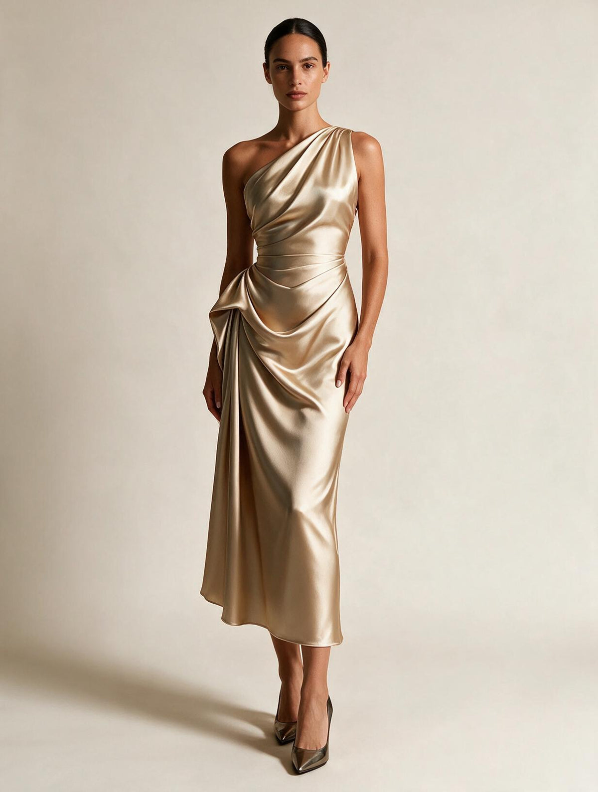 Elegant satin pleated dress by Elettra Ferri featuring flowing fabric and a sophisticated design, shown on a model.