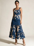 Elettra Ferri printed ruffle A-line midi dress with floral pattern, sleeveless design, and fitted waist on a model.