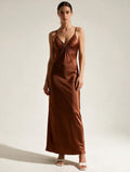 Elegant V-neck maxi dress by Elettra Ferri featuring flowing fabric and a fitted waist for a stylish, flattering look.