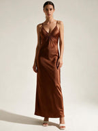 Elegant V-neck maxi dress by Elettra Ferri featuring flowing fabric and a fitted waist for a stylish, flattering look.