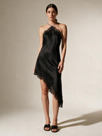 Elettra Ferri asymmetrical lace dress with intricate patterns and elegant design, displayed on a hanger against a neutral background.